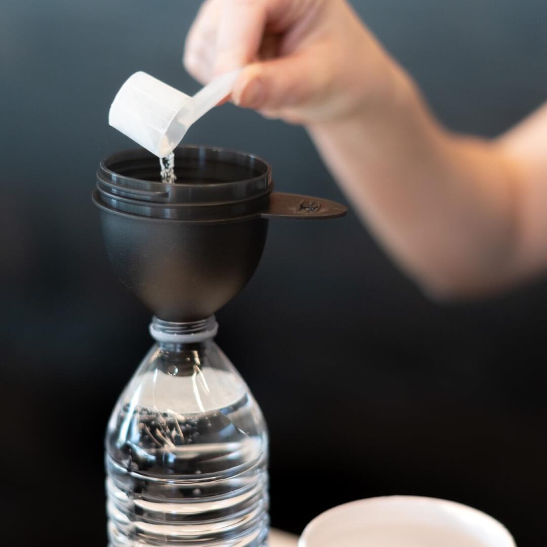 1st Phorm Gains Funnel attached to a water bottle